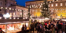 People enjoying the Christmas Market in Residenzplatz in Salzburg