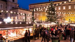 People enjoying the Christmas Market in Residenzplatz in Salzburg